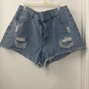 Denim shorts with distressed spots and some holes